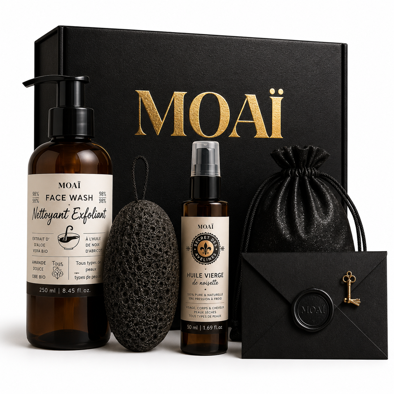 Coffret cadeau MOAÏ de soins visage bio pour homme comprenant un nettoyant nettoyant exfoliant, une huile vierge de noisette et une éponge konjac.
