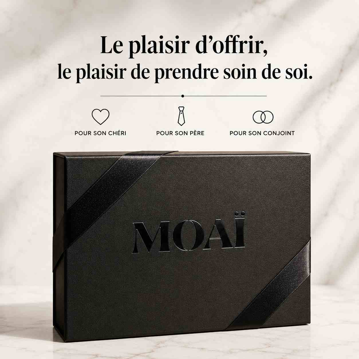 Coffret cadeau MOAÏ noir pour homme avec le texte "Le plaisir d'offrir, le plaisir de prendre soin de soi" et des icônes pour son chéri, son père ou son conjoint.